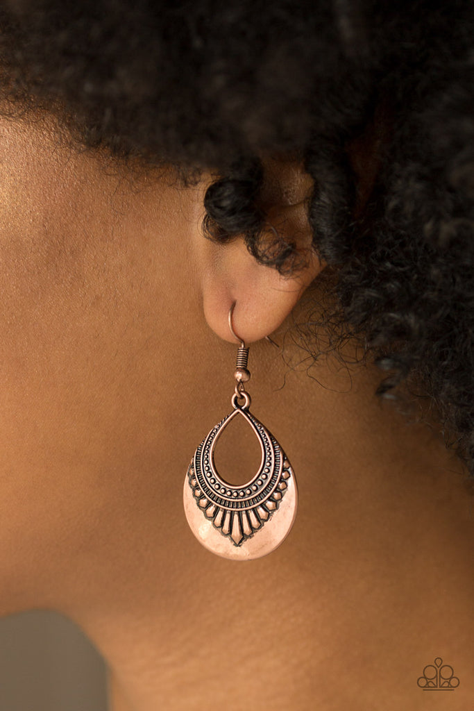 Tribal inspired details fan out across a glistening copper teardrop for a seasonal look. Earring attaches to a standard fishhook fitting.  Sold as one pair of earrings.  