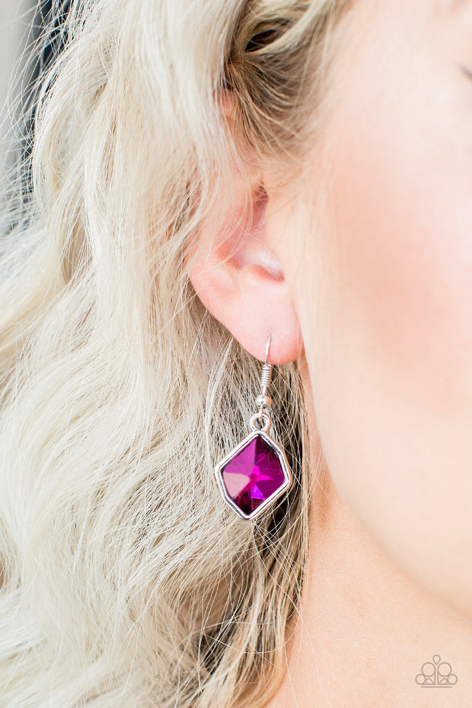 A faceted pink gem is pressed into an abstract silver frame for a refined look. Earring attaches to a standard fishhook fitting.  Sold as one pair of earrings.  