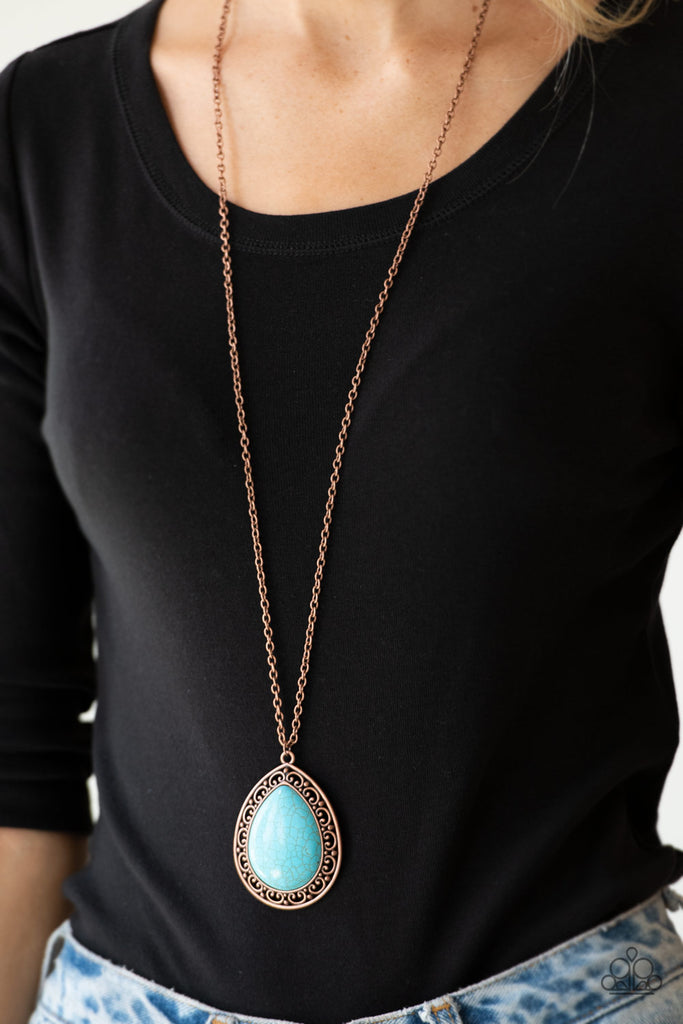 A refreshing turquoise stone teardrop is pressed into the center of an ornate copper frame, creating a dramatic pendant for a seasonal look. Features an adjustable clasp closure.  Sold as one individual necklace. Includes one pair of matching earrings.