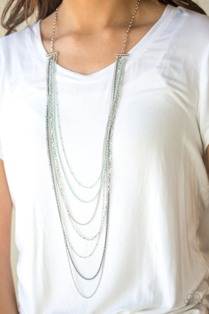Mismatched silver chains alternate with dainty gray and green chains down the chest, creating a colorful industrial look. Features an adjustable clasp closure.  Sold as one individual necklace. Includes one pair of matching earrings.