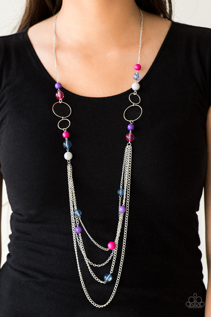 Infused with shimmery silver hoops, glassy and polished multicolored beads trickle along glistening silver chains for a bubbly look. Features an adjustable clasp closure.  Sold as one individual necklace. Includes one pair of matching earrings.