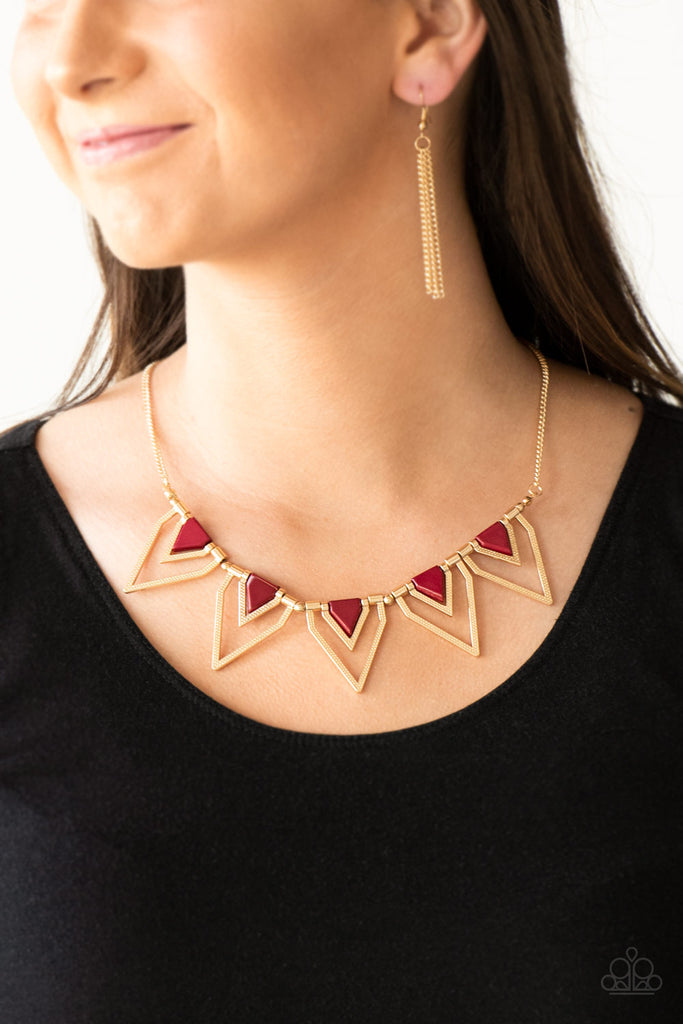 Infused with robust red beading, glistening gold triangular frames join below the collar, creating a fierce geometric fringe. Features an adjustable clasp closure.  Sold as one individual necklace. Includes one pair of matching earrings.  
