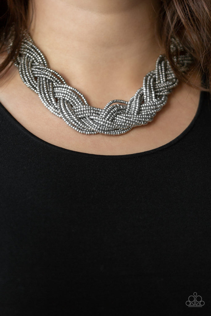 brazilian-brilliance-silver Strands of gunmetal seed beads create an indigenous braid below the collar. The gunmetal seed beads gradually morph into metallic silver beads at the center for a chic contrasting look. Features an adjustable clasp closure.  Sold as one individual necklace. Includes one pair of matching earrings.