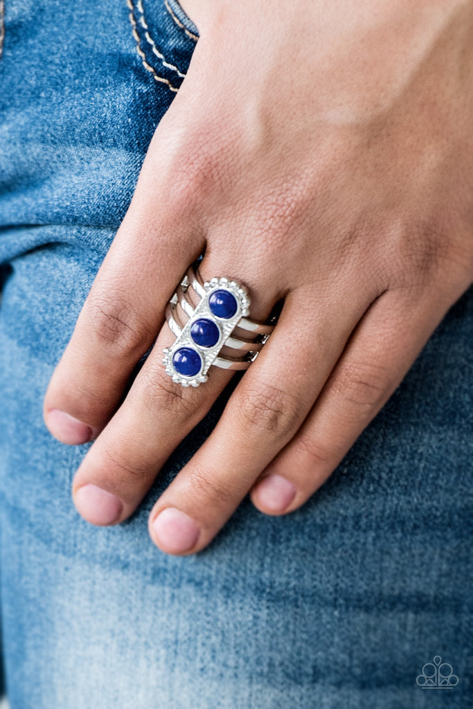 Infused with glassy blue beads, a studded silver frame is pressed into the center of a layered silver band for a seasonal look. Features a stretchy band for a flexible fit.  Sold as one individual ring.