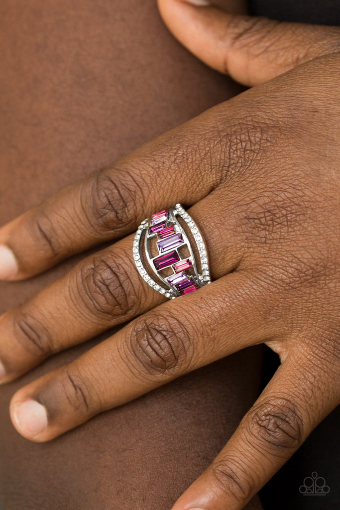 White rhinestone encrusted bands flank a row of emerald cut glass beads in shades of purple for a regal look. Features a stretchy band for a flexible fit.  Sold as one individual ring.  