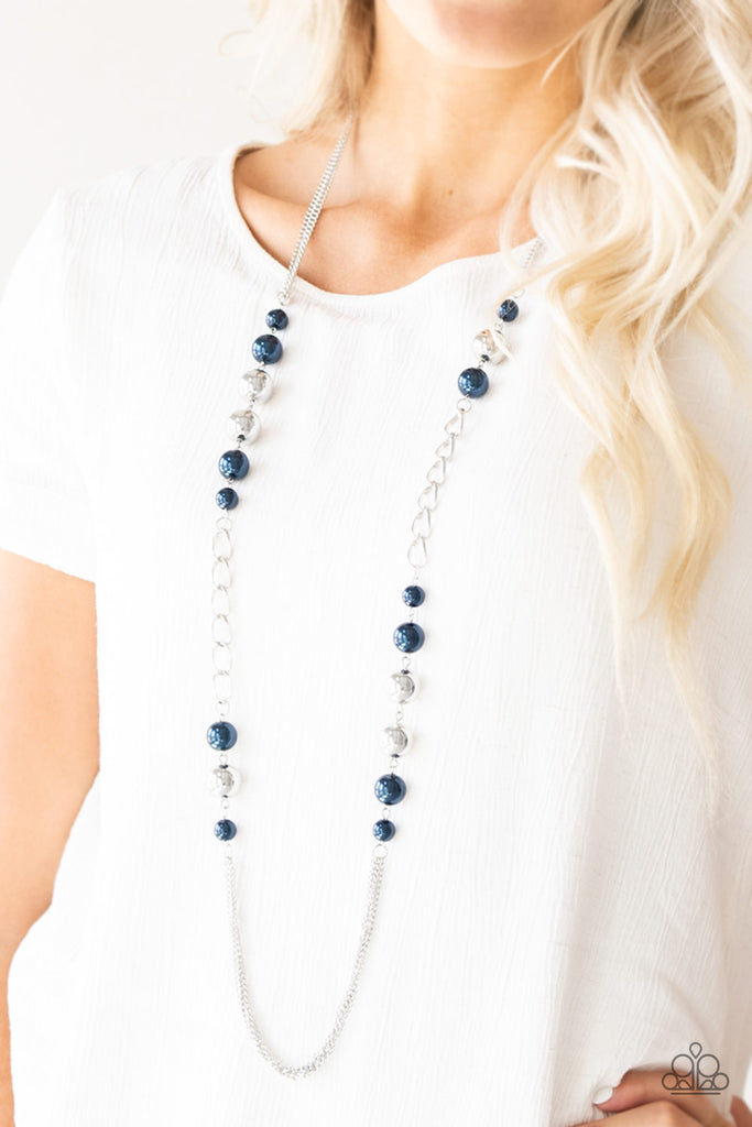 Varying in size, pearly blue and oversized silver beads give way to sections of bold silver chain. Layers of silver chains drape across the bottom of the design for a flawless finish. Features an adjustable clasp closure.  Sold as one individual necklace. Includes one pair of matching earrings.