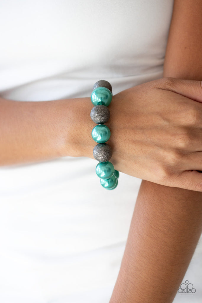 Dusted in glitter, sparkling gunmetal and pearly Ultramarine Green beads are threaded along a stretchy band around the wrist for a glamorous look.  Sold as one individual bracelet.