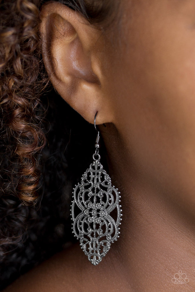 Brushed in a high-sheen shimmer, dotted gunmetal filigree swoops and swirls into a regal frame. Earring attaches to a standard fishhook fitting.  Sold as one pair of earrings.