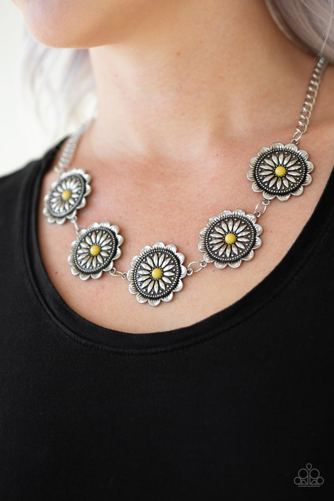 Infused with shiny yellow beaded centers, ornate floral stamped frames link below the collar for a colorfully, seasonal look. Features an adjustable clasp closure.  Sold as one individual necklace. Includes one pair of matching earrings.  