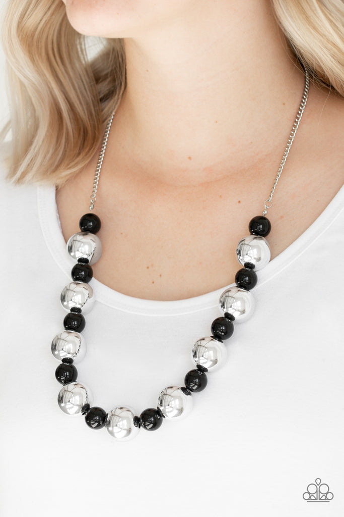 Polished black beads and dramatic silver beads drape below the collar for a perfect pop of color. Features an adjustable clasp closure.  Sold as one individual necklace. Includes one pair of matching earrings.