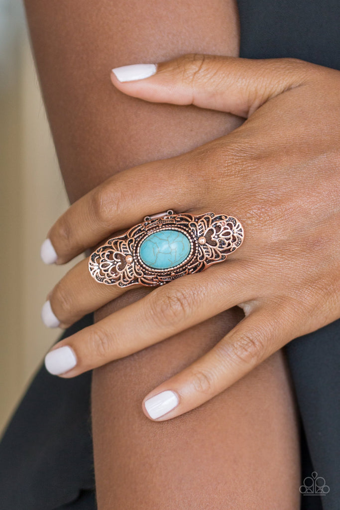 Dotted with a refreshing turquoise stone center, glistening copper filigree climbs the finger, coalescing into a dramatic frame. Features a stretchy band for a flexible fit.  Sold as one individual ring.