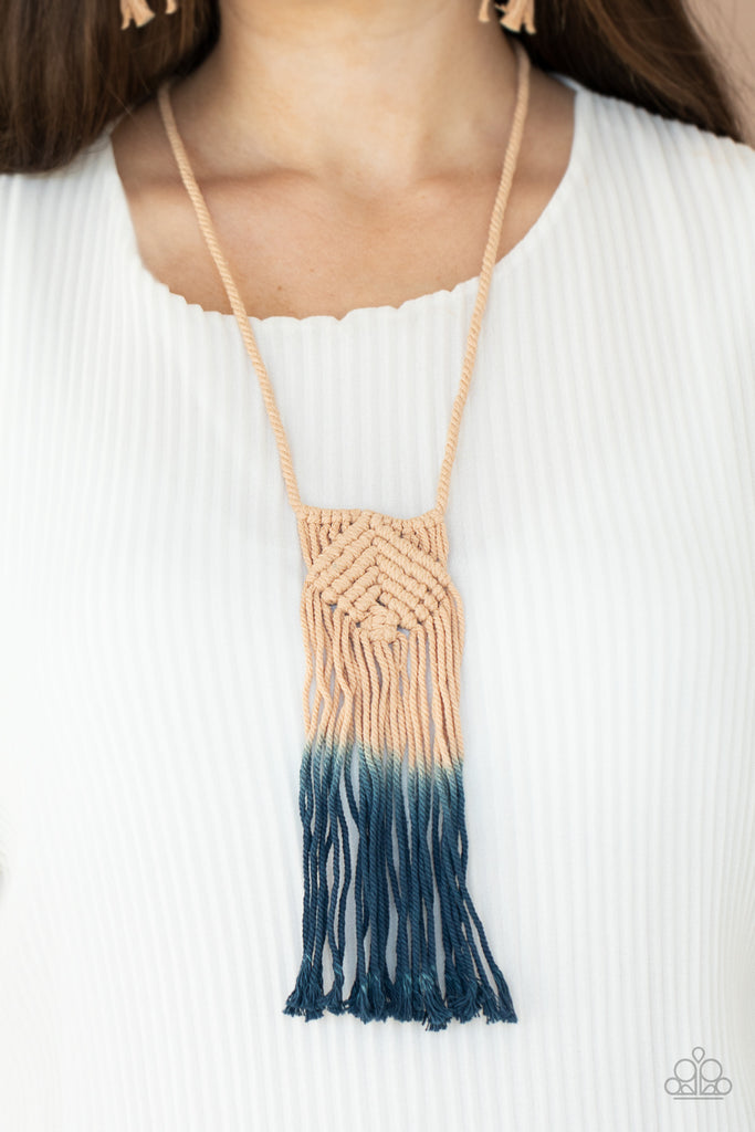 Fading from tan to Blue Depths, colorful twine-like cording delicately knots and weaves into a tasseled macramé inspired pendant across the chest. Features an adjustable sliding knot closure.  Sold as one individual necklace. Includes one pair of matching earrings.