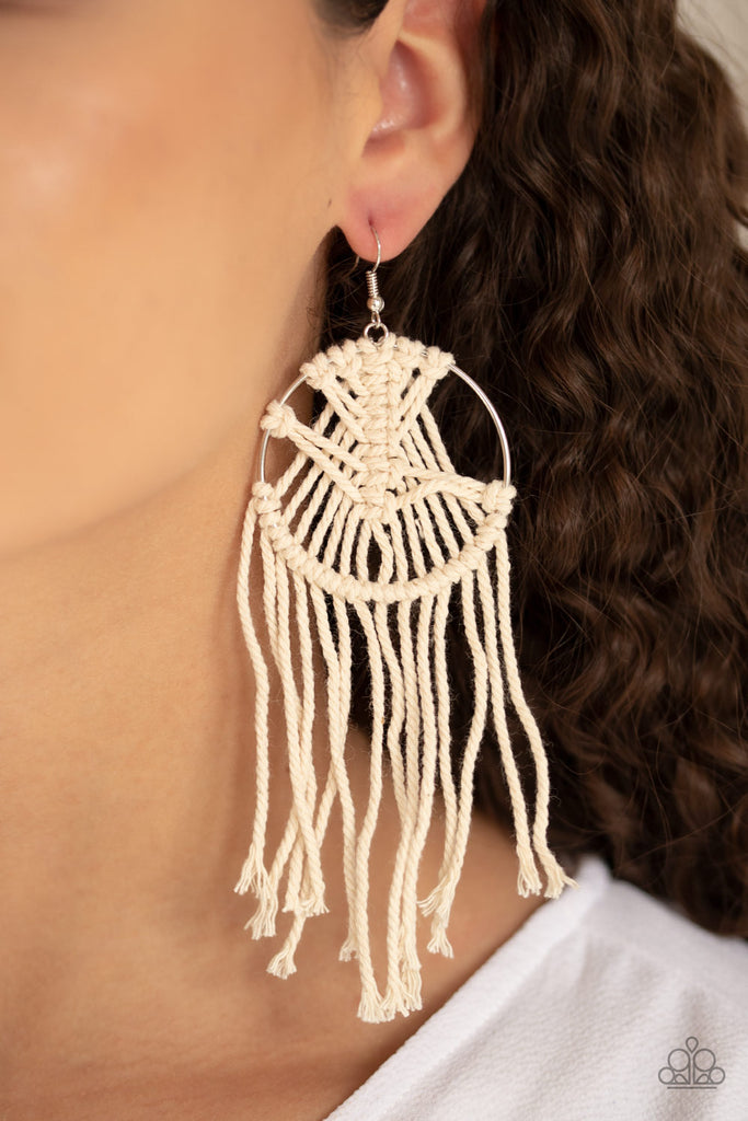 Soft Coral White twine is decoratively knotted around a silver hoop, creating a trendy tassel. Earring attaches to a standard fishhook fitting.  Sold as one pair of earrings.