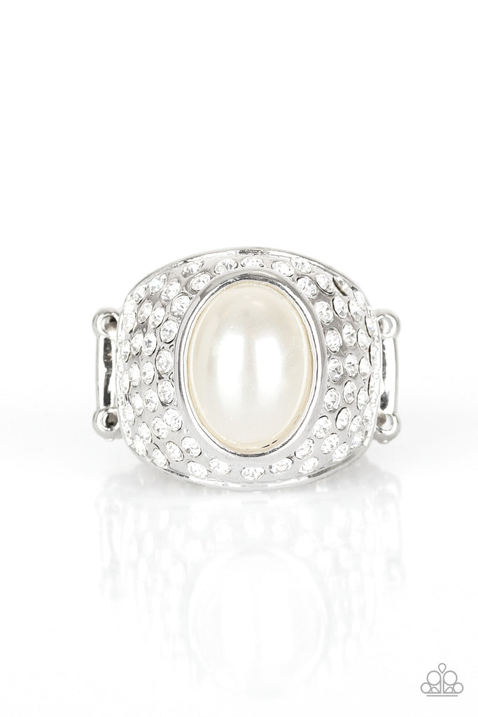 glittering-go-getter-white A pearly white bead is pressed into the center of a bold silver band radiating with countless white rhinestones, creating a dramatic statement piece atop the finger. Features a stretchy band for a flexible fit.  Sold as one individual ring.  Vintage Item: 9/2019