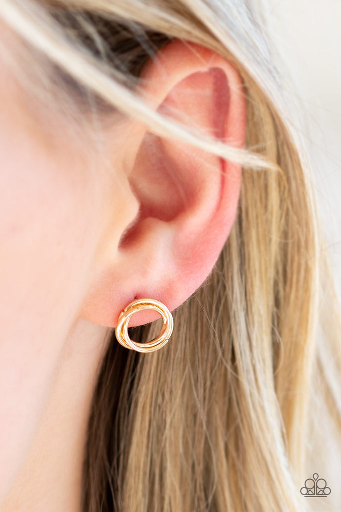 Shimmery gold bars swirl into a dainty hoop for a casual look. Earring attaches to a standard post fitting.  Sold as one pair of post earrings.
