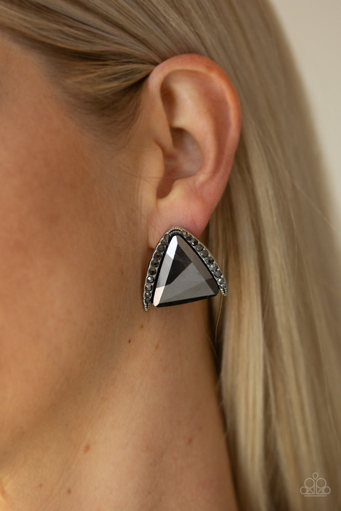 Featuring a regal triangular cut, an oversized hematite gem is nestled in an angled silver frame radiating with dainty hematite rhinestones for a glamorous look. Earring attaches to a standard post fitting.  Sold as one pair of post earrings.