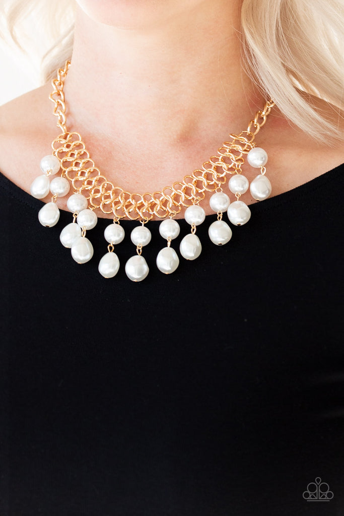 5th-avenue-fleek-gold  A collection of classic and imperfect white pearls dangle from a web of interlocking gold links below the collar, adding a modern twist to the timeless palette. Features an adjustable clasp closure.  Sold as one individual necklace. Includes one pair of matching earrings.