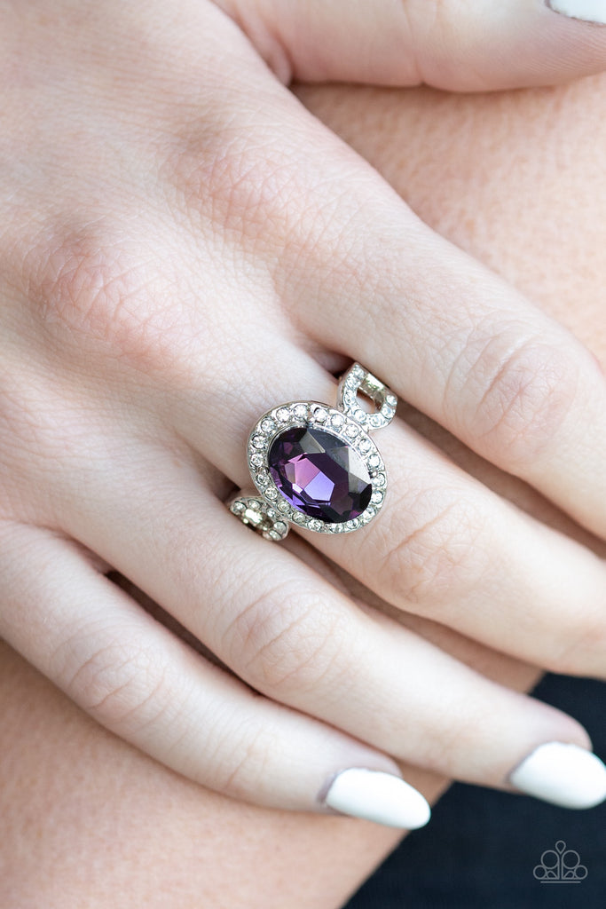 An oval purple gem is pressed into the center of a dainty silver frame radiating with glassy white rhinestones for a regal flair. Features a dainty stretchy band for a flexible fit.  Sold as one individual ring.  New Kit