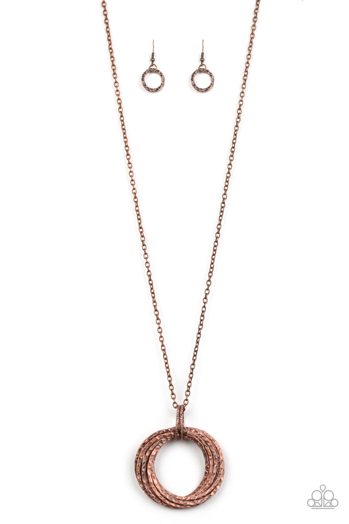 Featuring a hammered finish, a collection of interlocking copper hoops are threaded through the center of textured copper fittings. The dizzying pendant swings from the bottom of a lengthened copper chain for a dramatic industrial look. Features an adjustable clasp closure.  Sold as one individual necklace. Includes one pair of matching earrings.