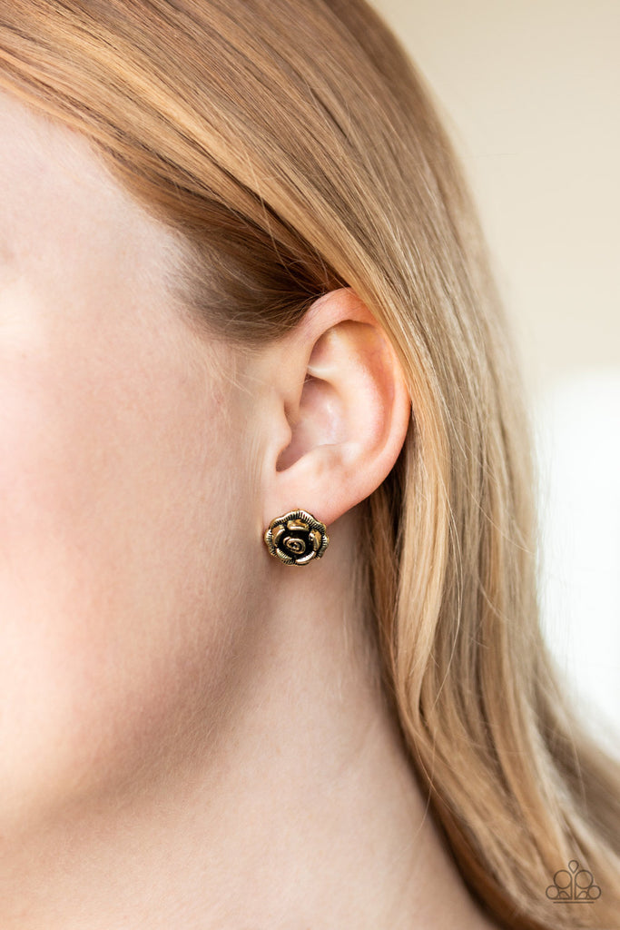 Etched in lifelike textures, antiqued brass petals gather into a dainty rosebud for a whimsical look. Earring attaches to a standard post fitting.  Sold as one pair of post earrings.
