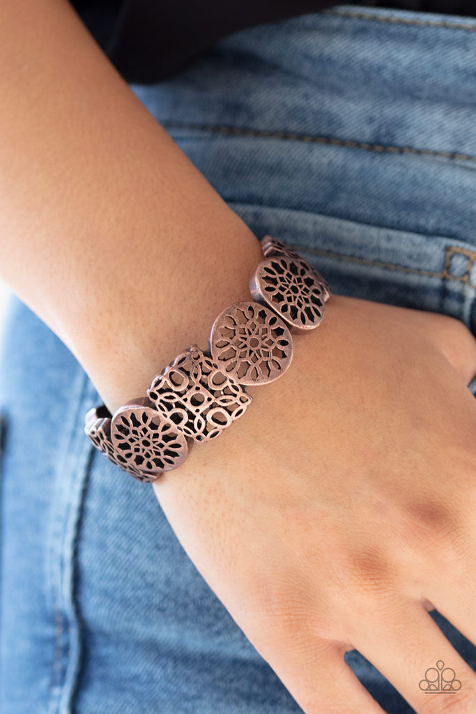 Brushed in an antiqued shimmer, a collection of mandala-like copper frames connect into a bold cuff-like bracelet around the wrist. Features a hinged closure.  Sold as one individual bracelet.  New Kit