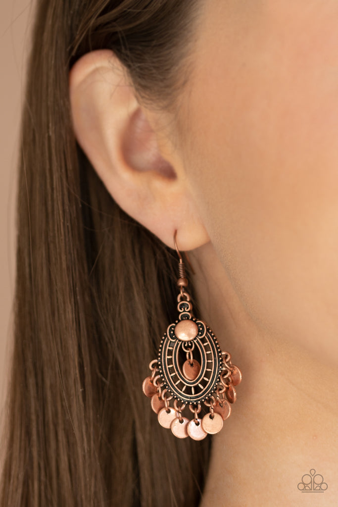 Dainty copper discs dangle from the bottom of an ornate copper frame, creating a dainty fringe. Earring attaches to a standard fishhook fitting.  Sold as one pair of earrings.