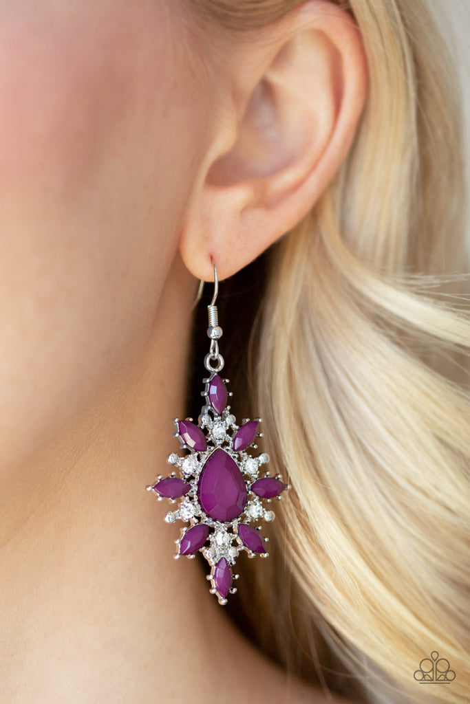 A collection of round white rhinestones and marquise purple beads flare out from the center of a faceted purple teardrop bead, coalescing into a glamorously colorful frame. Earring attaches to a standard fishhook fitting.  Sold as one pair of earrings.