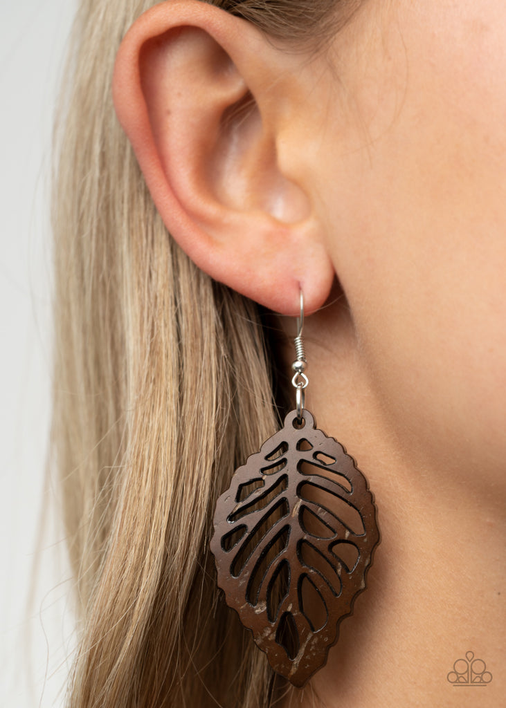 Brushed in a distressed rustic brown finish, an airy wooden frame has been cut into a leafy stenciled design for a woodsy look. Earring attaches to a standard fishhook fitting.  Sold as an individual pair of earrings.
