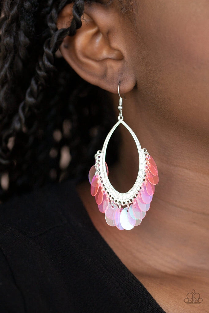 Iridescent pink sequins dangle from the bottom of a textured silver oval, creating an effervescent fringe. Earring attaches to a standard fishhook fitting.  Sold as one pair of earrings