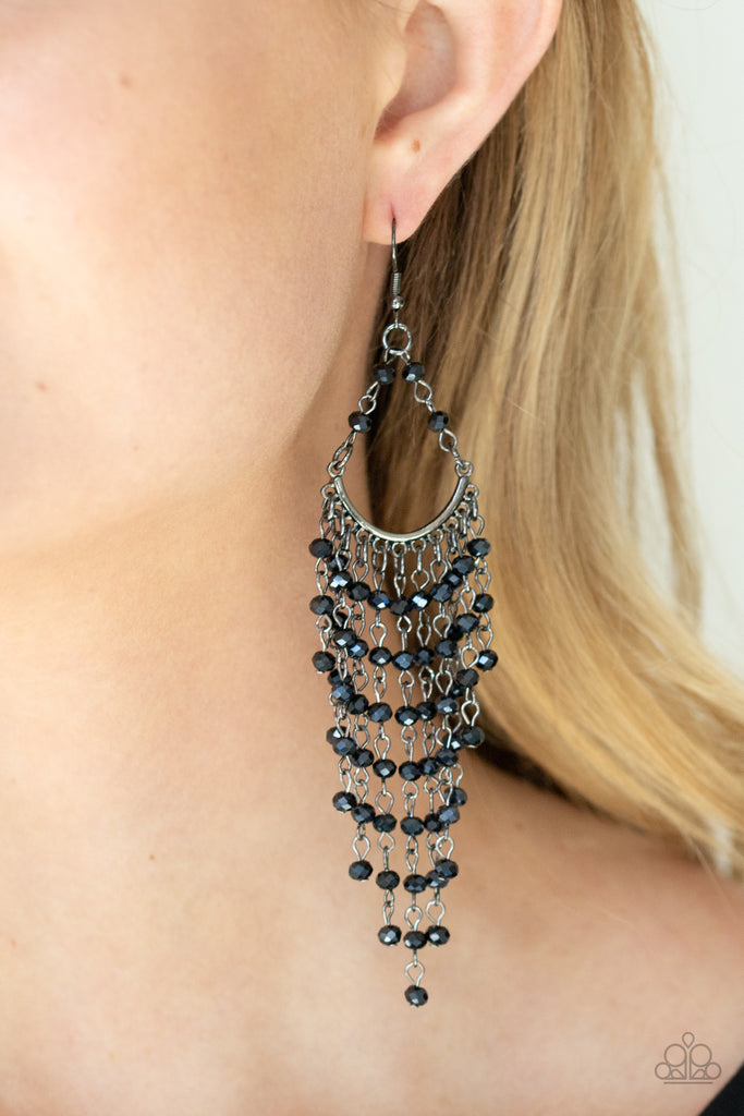Metallic blue beaded tassels cascade from the bottom of a bowing gunmetal bar, creating an ethereal tapered fringe. Earring attaches to a standard fishhook fitting.  Sold as one pair of earrings.