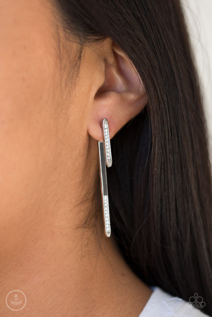 Encrusted in glassy white rhinestones, a dainty silver rod attaches to a double-sided post, designed to fasten behind the ear. As if dipped in white rhinestones, a larger silver rod peeks out beneath the ear for a bold look. Earring attaches to a standard post fitting.  Sold as one pair of double-sided post earrings.