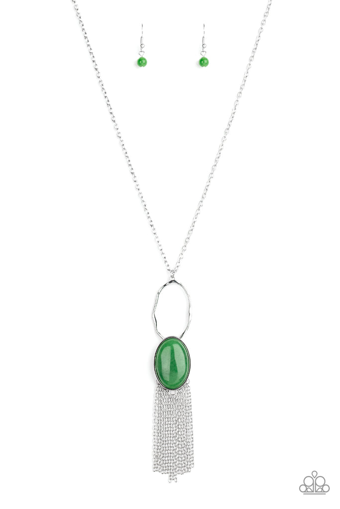 Nestled in a sleek silver frame, a dewy green stone swings from the bottom of a hammered silver hoop at the bottom of a shiny silver chain. Dainty silver chains stream from the bottom of the tranquil stone pendant, creating a whimsical tassel. Features an adjustable clasp closure.  Sold as one individual necklace. Includes one pair of matching earrings.