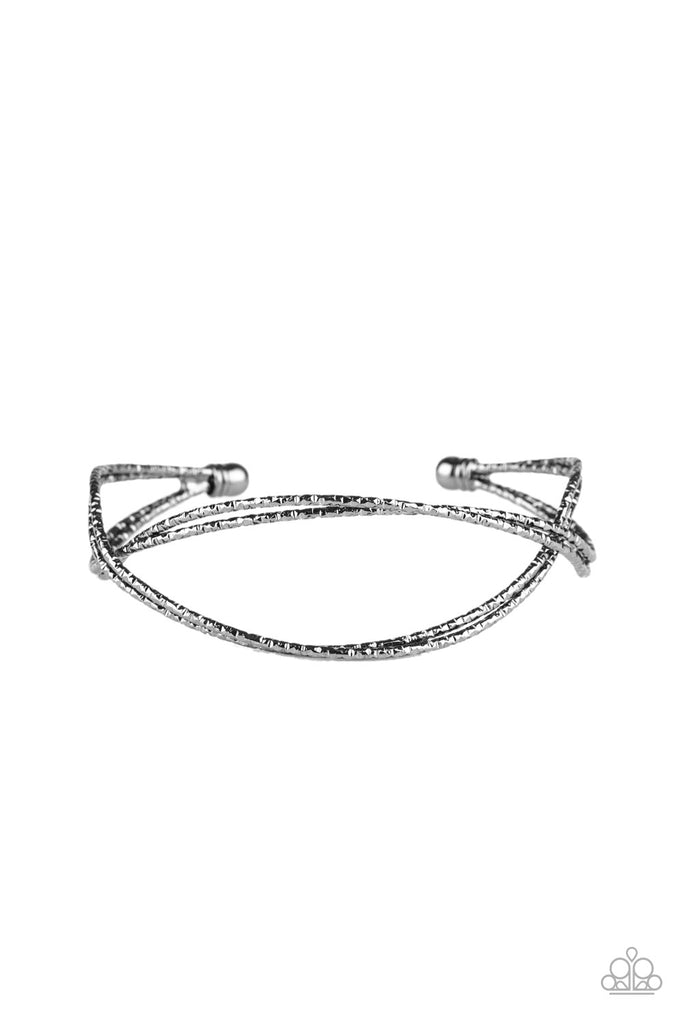 Featuring diamond-cut texture, dainty gunmetal bars delicately crisscross over and around the wrist, coalescing into an airy cuff.  Sold as one individual bracelet.  