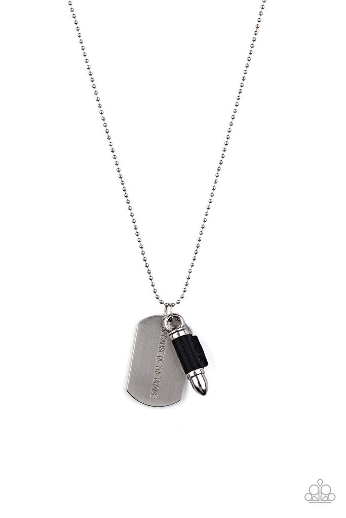 proud-patriot-black Pinched between a black leather fitting, a silver bullet pendant joins a silver dog tag at the bottom of a silver ball chain. The shimmery dog tag is stamped in the phrase, "Because of the Brave," for a patriotic finish. Features a ball and clasp closure.  Sold as one individual necklace.