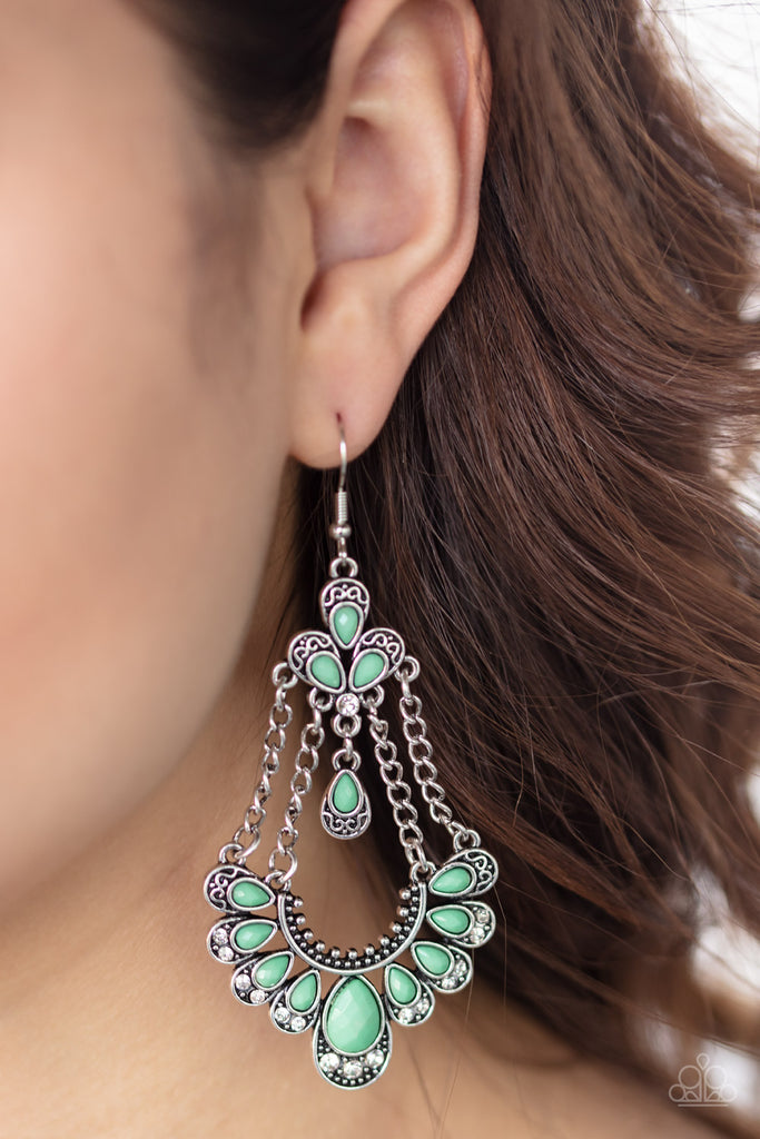Suspended by silver chains, faceted Biscay Green teardrop beads are pressed into decorative silver frames featuring silver filigree and glassy white rhinestones. The ornate frames coalesce into a whimsical frame. Earring attaches to a standard fishhook fitting.  Sold as one pair of earrings.