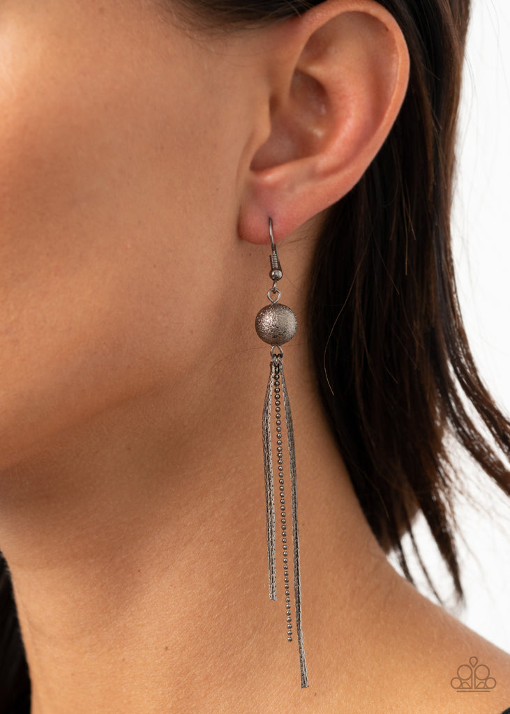 A gunmetal foiled bead gives way to matching flattened and dainty ball chains, creating a sleek tasseled look. Earring attaches to a post fitting.  Sold as one pair of earrings.