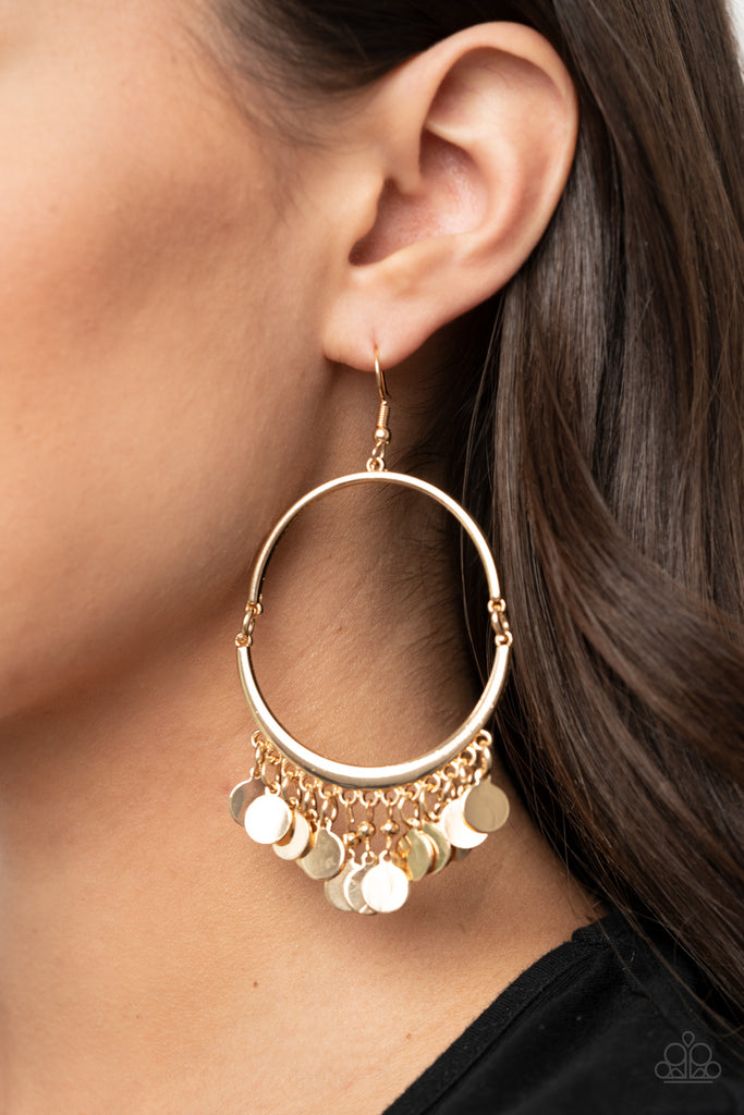 Shimmery gold discs dance along the bottom of two gold frames that delicately link into an airy hoop, creating a playful metallic fringe. Earring attaches to a standard fishhook fitting.  Sold as one pair of earrings.