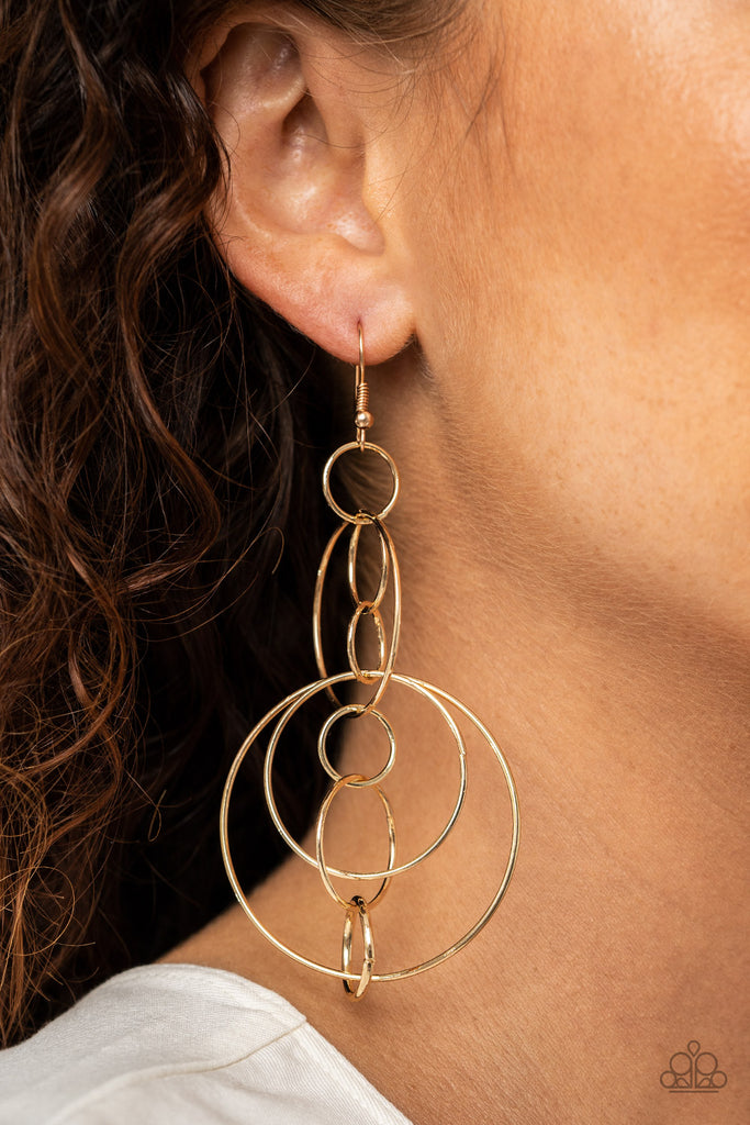 Small and medium sized gold links delicately alternate into an airy chain, while larger gold hoops haphazardly connect the chain into a dizzying lure. Earring attaches to a standard fishhook fitting.  Sold as one pair of earrings.  