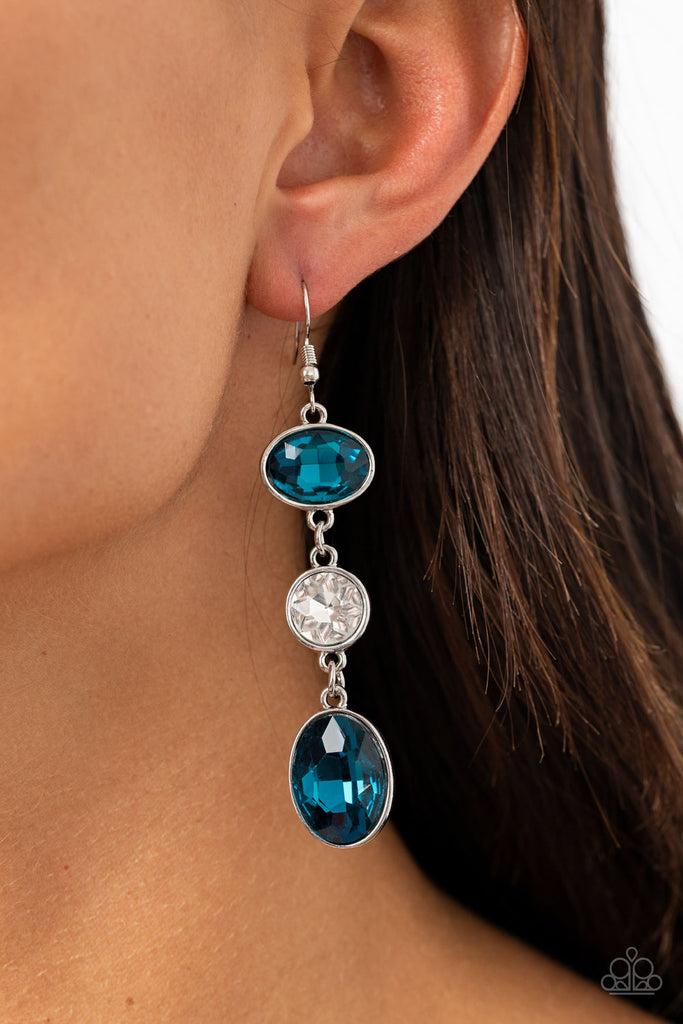 Encased in sleek silver frames, mismatched blue oval and round white rhinestones trickle from the ear, creating an elegant lure. Earring attaches to a standard fishhook fitting.  Sold as one pair of earrings.