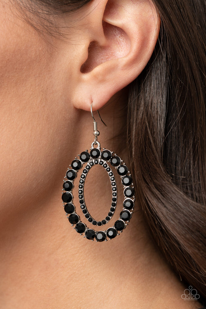 An oversized ring of glittery black rhinestones encircle a dainty ring of black rhinestones, stacking into a blinding frame. Earring attaches to a standard fishhook fitting.  Sold as one pair of earrings.  New Kit