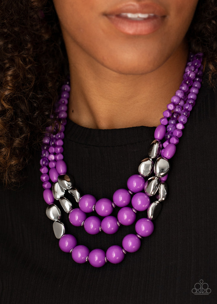 Featuring polished and glassy finishes, imperfect purple and silver beads are threaded along three invisible wires, creating colorful layers below the collar. Features an adjustable clasp closure.  Sold as one individual necklace. Includes one pair of matching earrings.