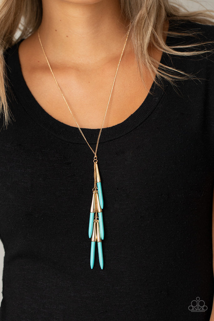Capped in glistening gold fittings, refreshing turquoise stone tusk-like bars haphazardly dangle from two dainty gold chains, creating an earthy fringe at the bottom of a lengthened gold chain. Features an adjustable clasp closure.  Sold as one individual necklace. Includes one pair of matching earrings.