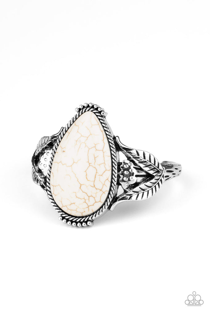 Encased in a silver rope-like frame, an oversized white teardrop stone is pressed into the center of an airy silver cuff abloom with leafy floral designs.  Sold as one individual bracelet.  New Kit
