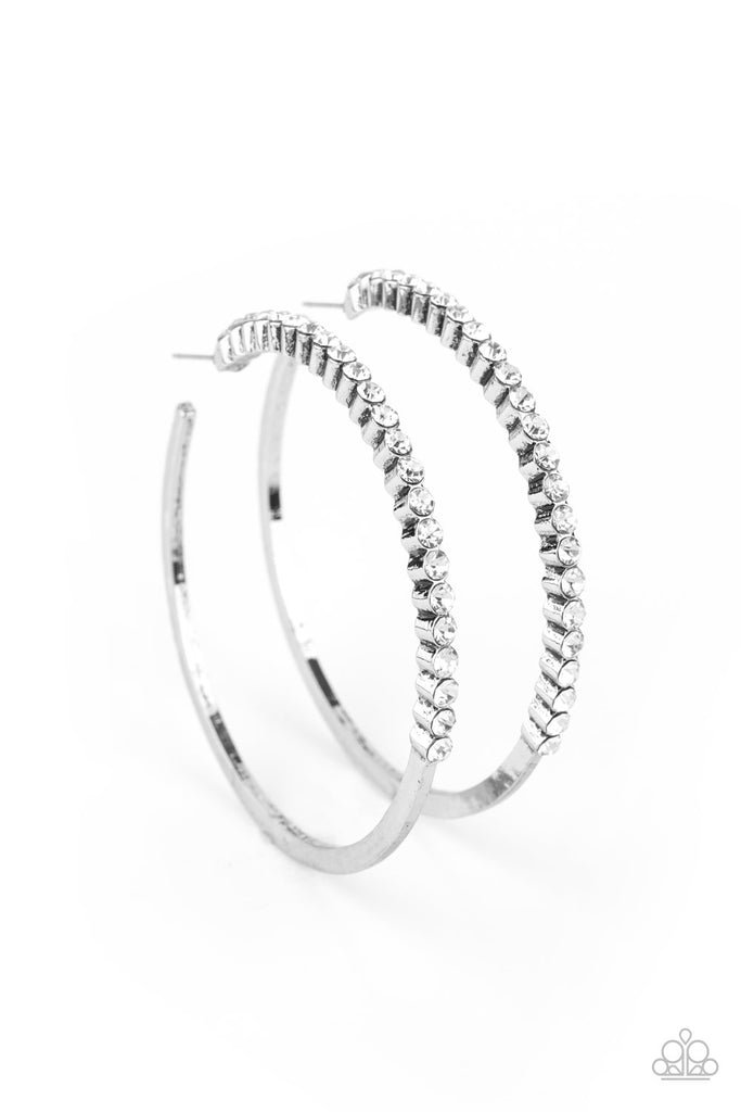 The front half of a glistening silver hoop is encrusted in a glassy row of dainty white rhinestones for a glamorously timeless finish. Earring attaches to a standard post fitting. Hoop measures approximately 2 1/2" in diameter.  Sold as one pair of hoop earrings.