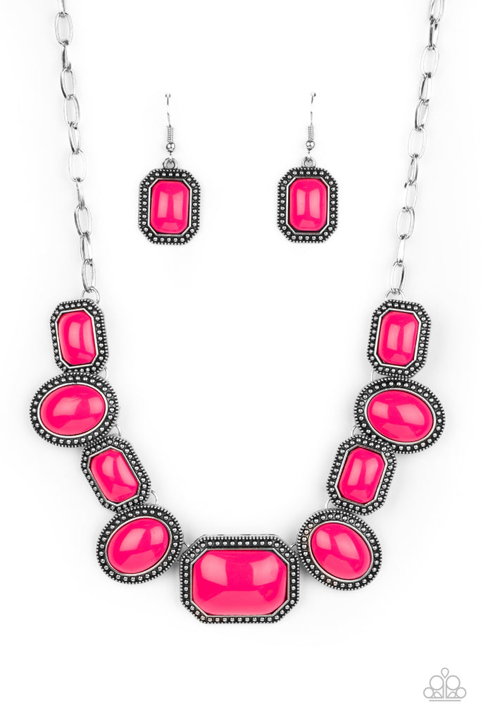 Bordered in silver studded oval and rectangular frames, a flamboyant collection of Pink Peacock beaded frames delicately link below the collar for a colorfully rustic flair. Features an adjustable clasp closure.  Sold as one individual necklace. Includes one pair of matching earrings.