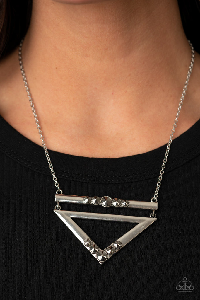 Dotted in oversized hematite rhinestones, a shiny silver bar and glistening silver triangular frame link below the collar for a sparkly stacked look. Features an adjustable clasp closure.  Sold as one individual necklace. Includes one pair of matching earrings.