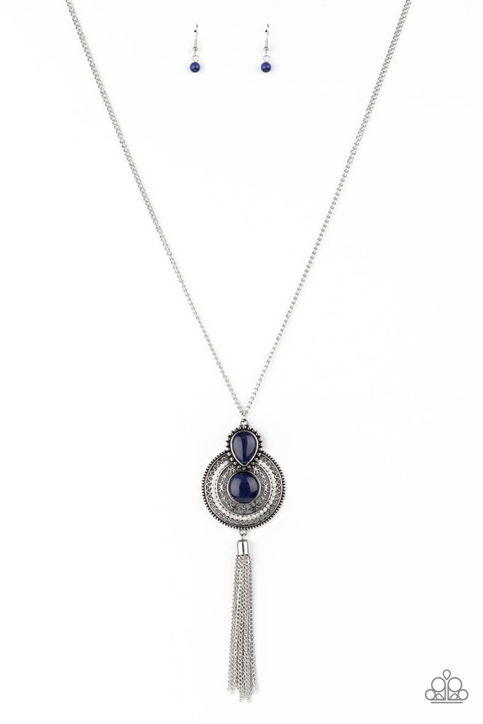 mountain-mystic-blue Dotted with a teardrop and round Blue Depths cat's eye stone accents, an ornate silver pendant radiates with glassy white rhinestones and floral filigree at the bottom of a lengthened silver chain. A shimmery silver chain tassel swings from the bottom of the medallion-like pendant, creating whimsical movement. Features an adjustable clasp closure.  Sold as one individual necklace. Includes one pair of matching earrings