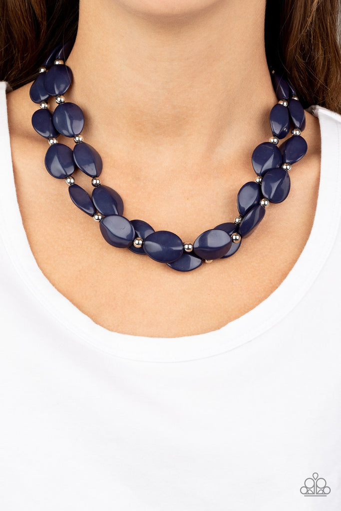 Two rows of dainty silver beads and faceted Blue Depths faux stone beads alternate along invisible wires below the collar, creating bold, colorful layers. Features an adjustable clasp closure.  Sold as one individual necklace. Includes one pair of matching earrings.