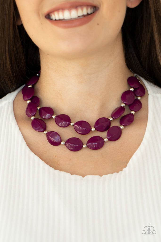 Two rows of dainty silver beads and faceted Magenta Purple faux stone beads alternate along invisible wires below the collar, creating bold, colorful layers. Features an adjustable clasp closure.  Sold as one individual necklace. Includes one pair of matching earrings.