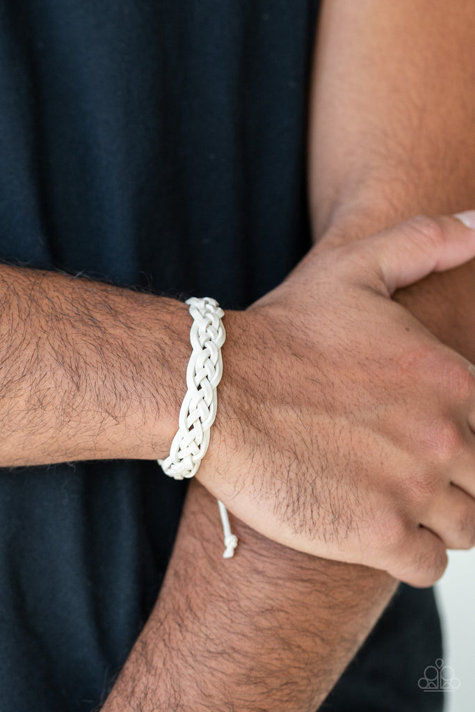 Rustic white leather laces decoratively weave across the wrist, creating a rugged centerpiece. Features an adjustable sliding knot closure.  Sold as one individual bracelet.  